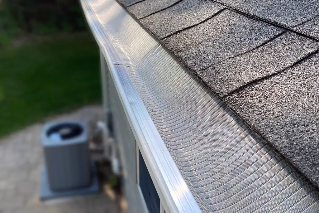 Beautiful newly installed residential roof on a modern American home with fresh clean shingles